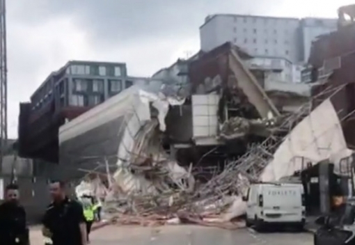 Three people were injured when a large scaffolding collapsed at a Reading town centre demolition site yesterday.