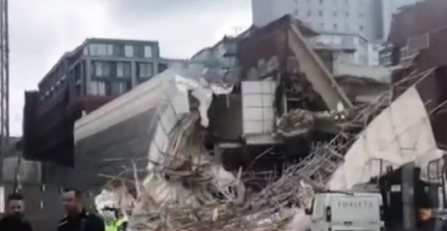 Three people were injured when a large scaffolding collapsed at a Reading town centre demolition site yesterday.